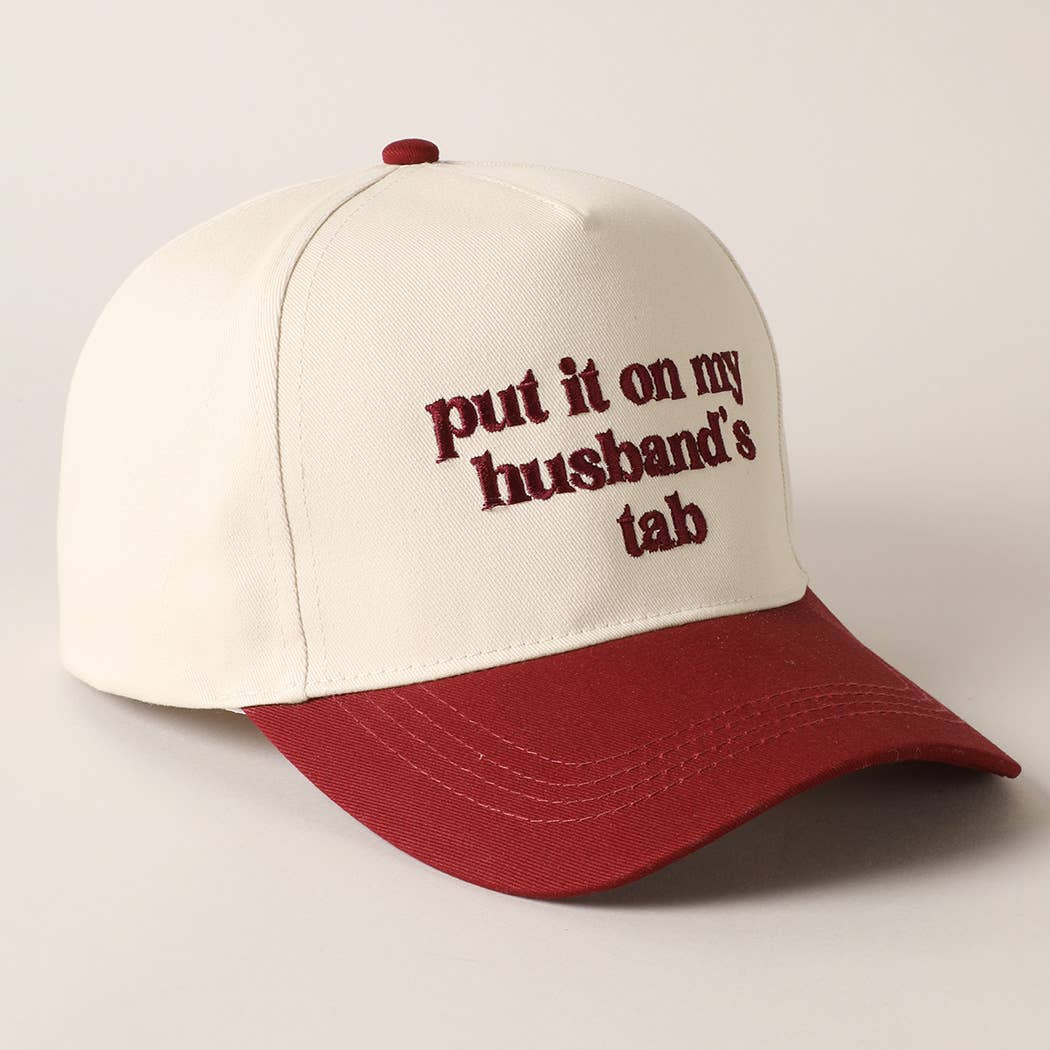 Put it on my husband's tab Trucker Hat