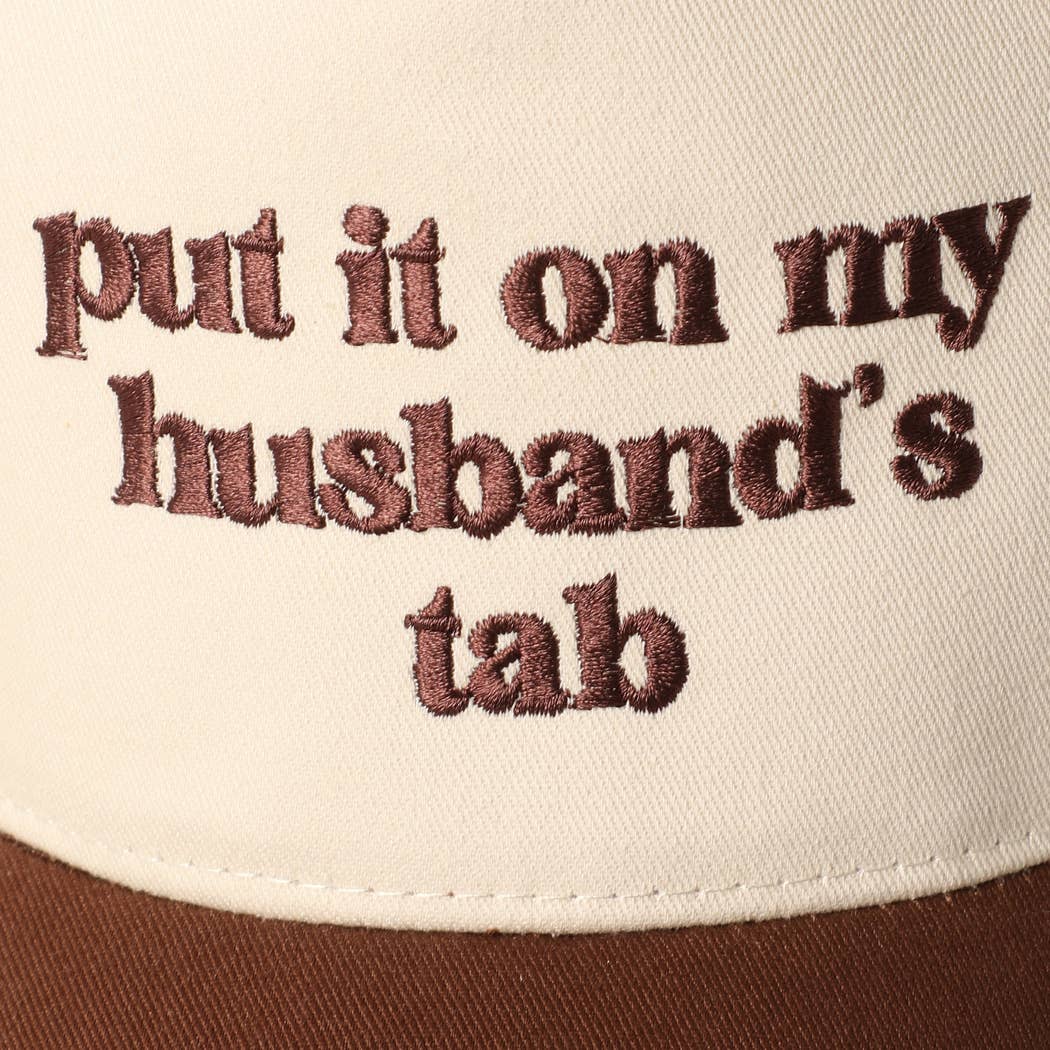 Put it on my husband's tab Trucker Hat