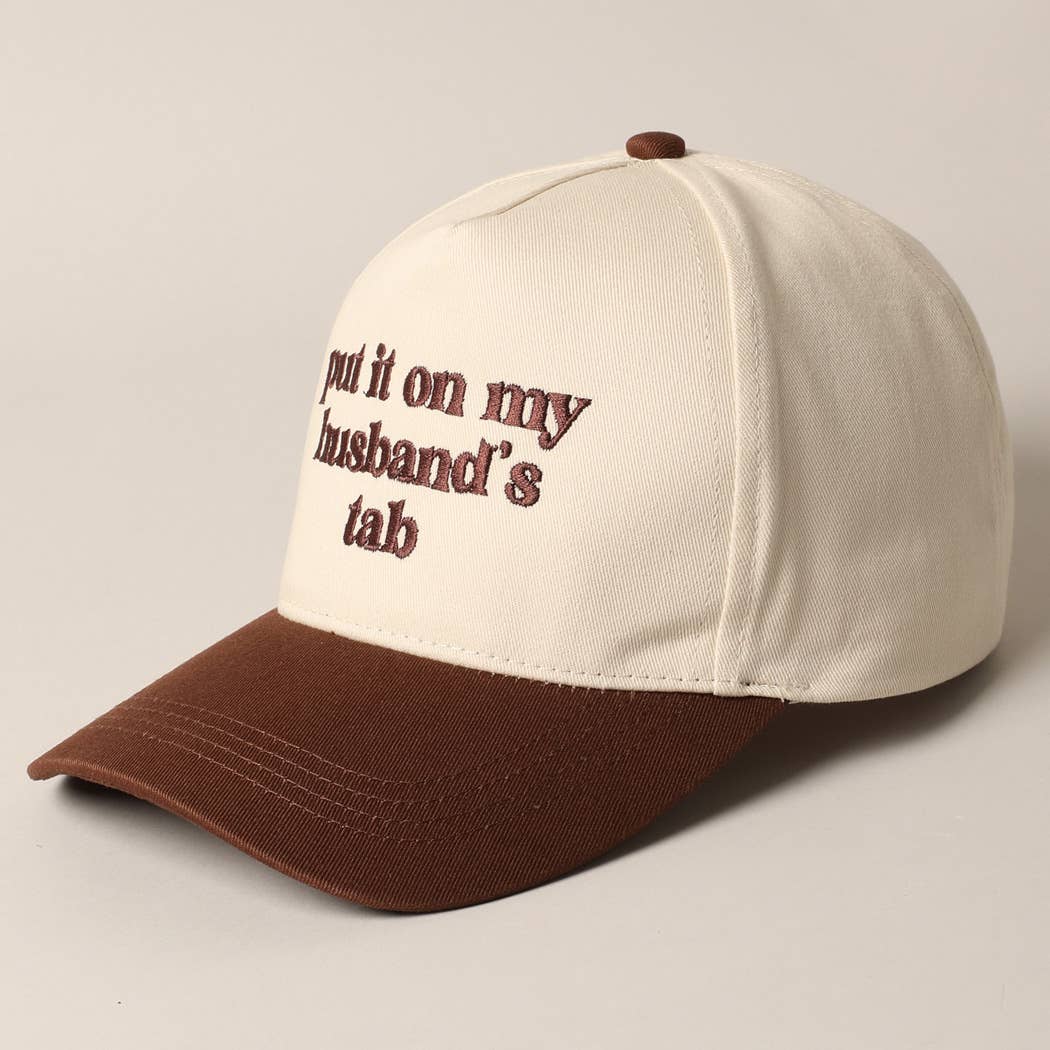 Put it on my husband's tab Trucker Hat