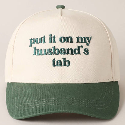 Put it on my husband's tab Trucker Hat