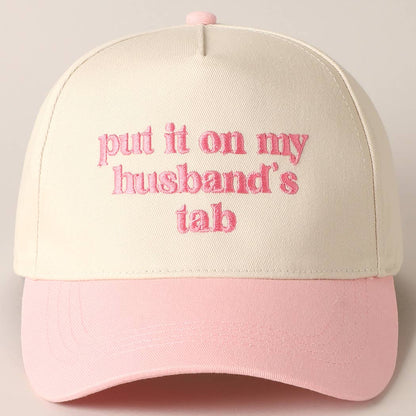 Put it on my husband's tab Trucker Hat