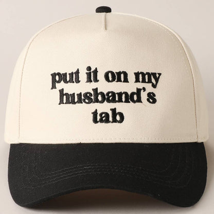 Put it on my husband's tab Trucker Hat