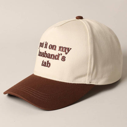 Put it on my husband's tab Trucker Hat