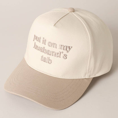Put it on my husband's tab Trucker Hat